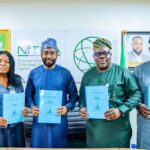 Director General NITDA, Kashifu Inuwa CCIE, Director General DAWN Commission Dr Seye Oyeleye alongside representatives of both organisations, display signed copies of the Memorandum of Understanding (MoU) upon its signing at NITDA Headquarters, Abuja.